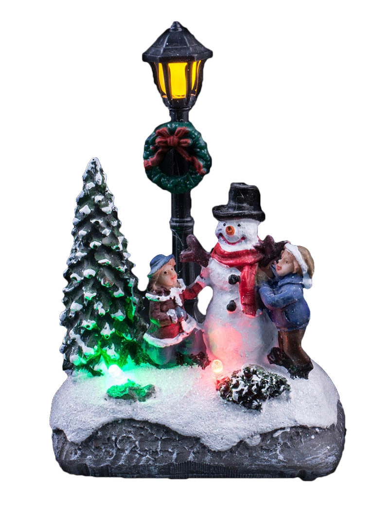 Освещенная рождественская сцена с детьми украшает снеговика